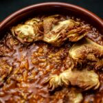 Arroz meloso de setas y alcachofas